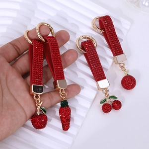 Sparkling crystal cherry and strawberry keychain with red rhinestones on a gold ring