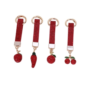 Sparkling rhinestone cherry and strawberry keychains with golden rings in a set
