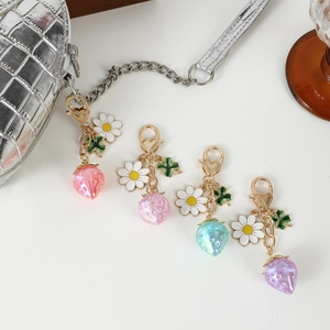 Translucent strawberry keychain set with heart buckle and daisy charm in pastel colors
