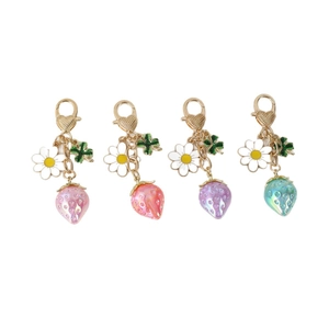 Translucent strawberry keychains in pink, orange, purple, and blue with heart lobster clasps