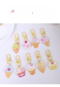 Collection of colorful enamel ice cream and cupcake keychains with yellow lobster clasps