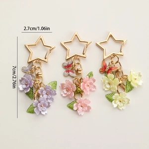 Star-shaped keychain set with colorful enamel flowers and butterflies for bags