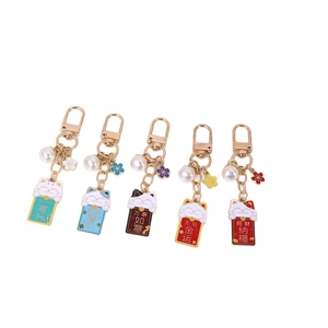 Set of five cute lucky cat metal keychains with colorful enamel and pearl charms