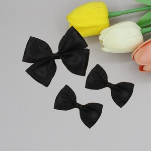 Elegant black satin bow hair clip set with large and small ribbon bows for women