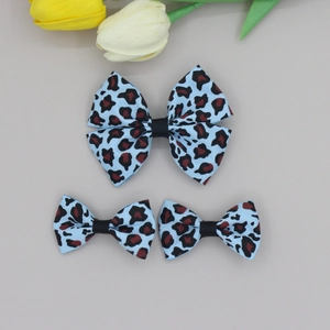 Three-piece leopard print bow hair clips set with blue ribbed texture and black ribbon center
