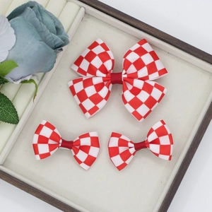 Detail of red and white checkered bow hair clips set made of high-quality grosgrain ribbon