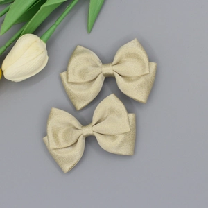 Elegant champagne gold grosgrain ribbon bow hair clips set for girls in a two-pack set