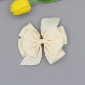 Elegant cream satin ribbon bow hair clip for women with layered design for daily hairstyling