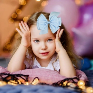 Elegant large light blue satin bow hair clip accessory for girls with layered ribbon style