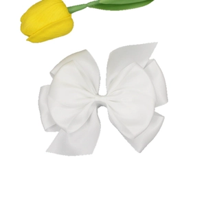 Elegant multi-layer white ribbon bow hair clip for women on a clean white background