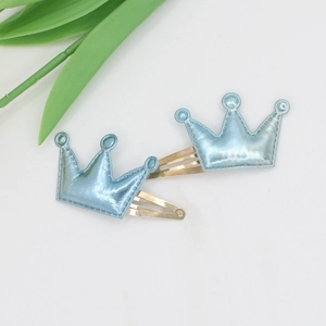 Cute set of two light blue crown hair clips for girls with a gold metallic finish