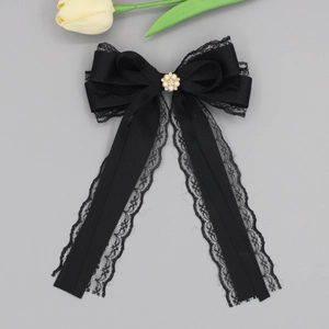 Elegant black satin lace bow hair clip with pearl flower center and long ribbon streamers
