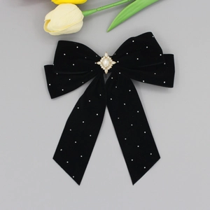 Elegant black velvet bow hair clip with sparkling rhinestones and a central faux gemstone