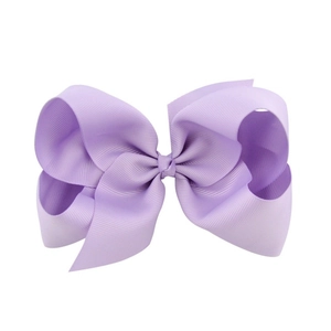 Detailed close-up of 6-inch light purple grosgrain ribbon hair bow with ribbed texture