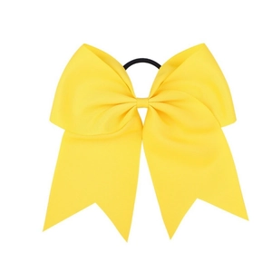 Detailed close-up of a large yellow grosgrain ribbon bow with a high-elastic hair band