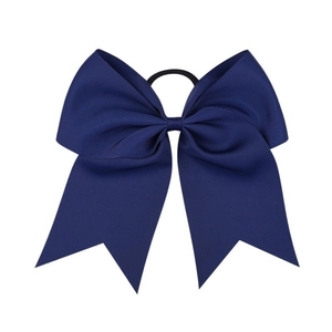 Detail view of large 8-inch dark blue ribbed grosgrain cheer bow with elastic hair tie
