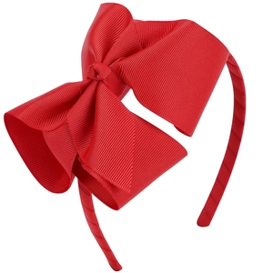 Détail d'un serre-tête avec grand nœud rouge de 5 pouces en ruban gros-grain