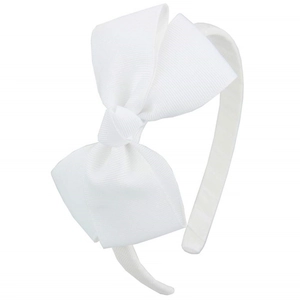 Detailed view of the white ribbed grosgrain ribbon bow on a narrow girls hairband