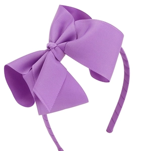 Détail du serre-tête avec gros nœud violet de 5 pouces en ruban gros-grain