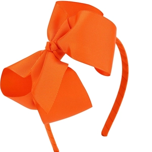Détail d'un serre-tête orange de 5 pouces avec nœud en ruban gros-grain à texture fine