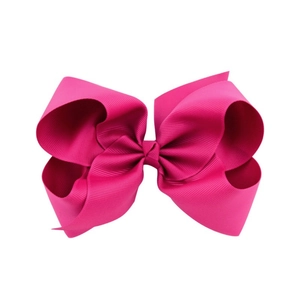 Macro detail of the bright rose red 6-inch ribbed grosgrain hair bow with double layers