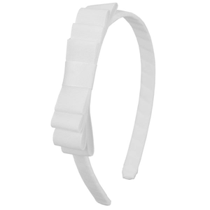 Detail showing white grosgrain ribbon texture and layered bow on children's headband