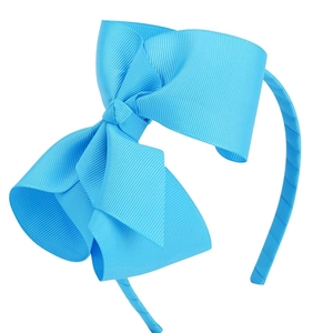 Détail du serre-tête avec nœud en ruban gros-grain bleu vif de 12 cm pour filles