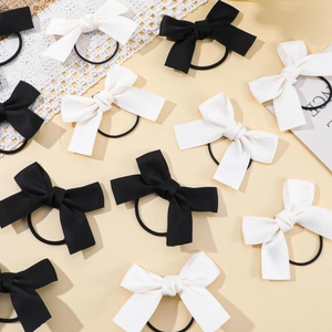 Elegant bow hair ties set in black and cream silk fabric with high elasticity