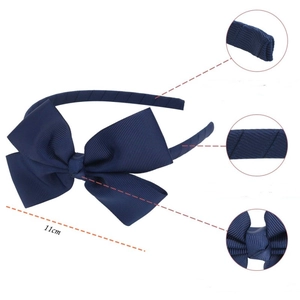 Navy blue grosgrain ribbon bow headband for girls featuring detailed ribbed fabric texture