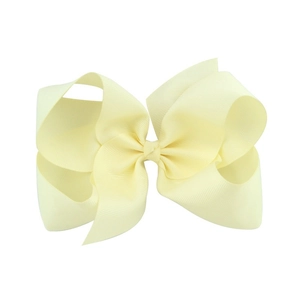 Detailed macro view of 6-inch pale yellow grosgrain ribbon hair bow with ribbed texture