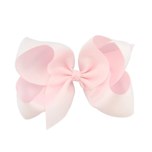 Detailed close-up showing the ribbed texture of a pink 6-inch grosgrain ribbon bow