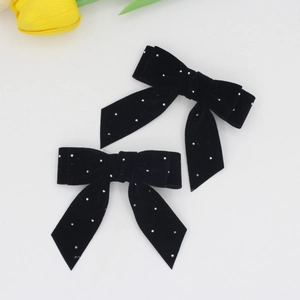 Elegant pair of black velvet bow hair clips with rhinestones and long ribbon tails