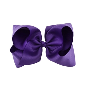 Detailed close-up of a 6-inch dark purple grosgrain ribbon hair bow for girls