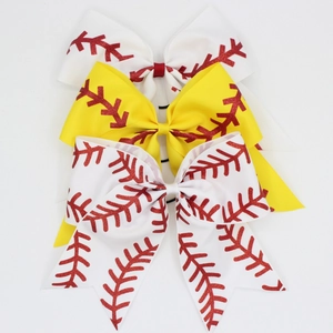 Detailed macro view of baseball themed ribbon bows with red sequin stitch patterns