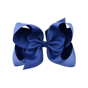 Detailed view of dark blue 6-inch grosgrain ribbon bow with classic ribbed texture