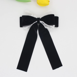Elegant black velvet hair clip with white lace trim and long ribbons for women