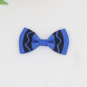 Detailed view of blue and black wave pattern grosgrain ribbon handmade bow hair clip