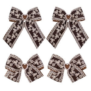 Ribbed lace bow hair clips for girls with brown heart embroidery and shimmering details