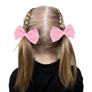 Pink velvet bow hair clips for girls set on hairstyle with soft texture and elegant design