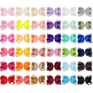 Set of 36 colorful 6-inch ribbed swallowtail bow hair clips for girls on white background