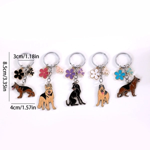 Set of five German Shepherd enamel keychains with floral charms and metal rings
