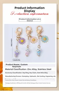 Détails des porte-clés marguerites colorés avec fermoirs en forme de cœur et perles