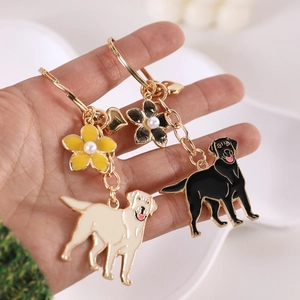 Golden Retriever and Labrador enamel keychains with floral charms and heart clips