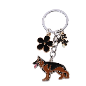Realistic German Shepherd metal keychain with black floral charm and silver ring