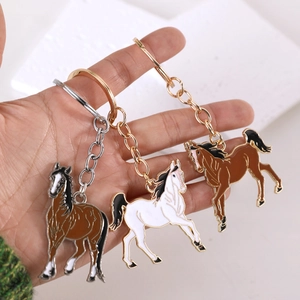 Running horse enamel keychain in brown and white finish with gold and silver alloy ring