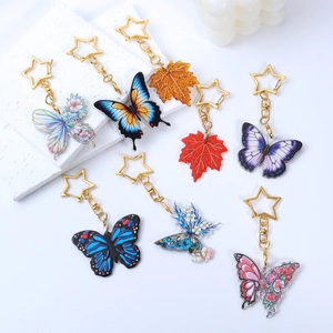 Colorful acrylic butterfly and maple leaf keychains with golden star shaped metal clasps