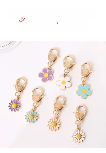Detail of alloy flower keychains in pastel colors with heart-shaped lobster clasps
