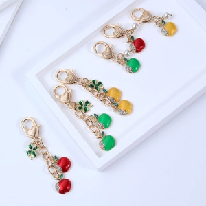 Three-color apple keychain with golden alloy charms and rhinestones for bags