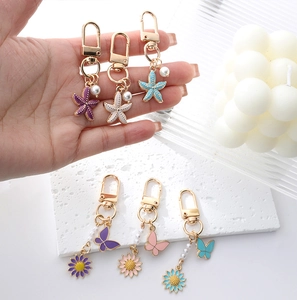 Pastel alloy keychains with starfish pearls and butterflies for bags and clothing accessories