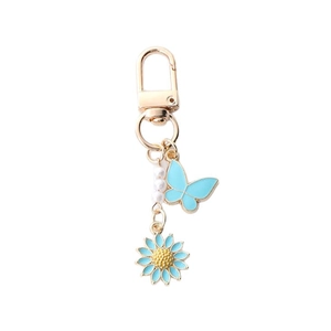 Blue butterfly and daisy charm keychain with pearls and gold-plated metal alloy chain